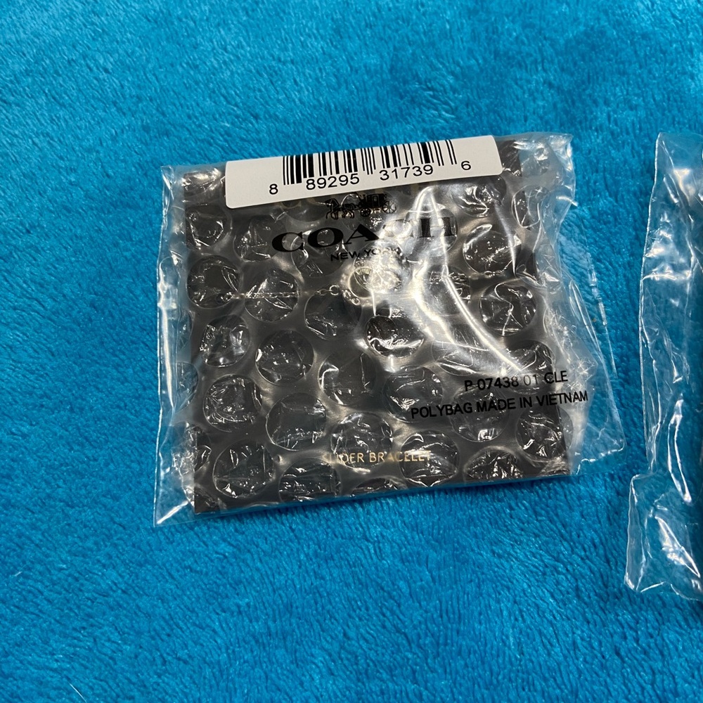 Coach brand new jewelry set. Necklace, earring and bracelet set. - Picture 3 of 11